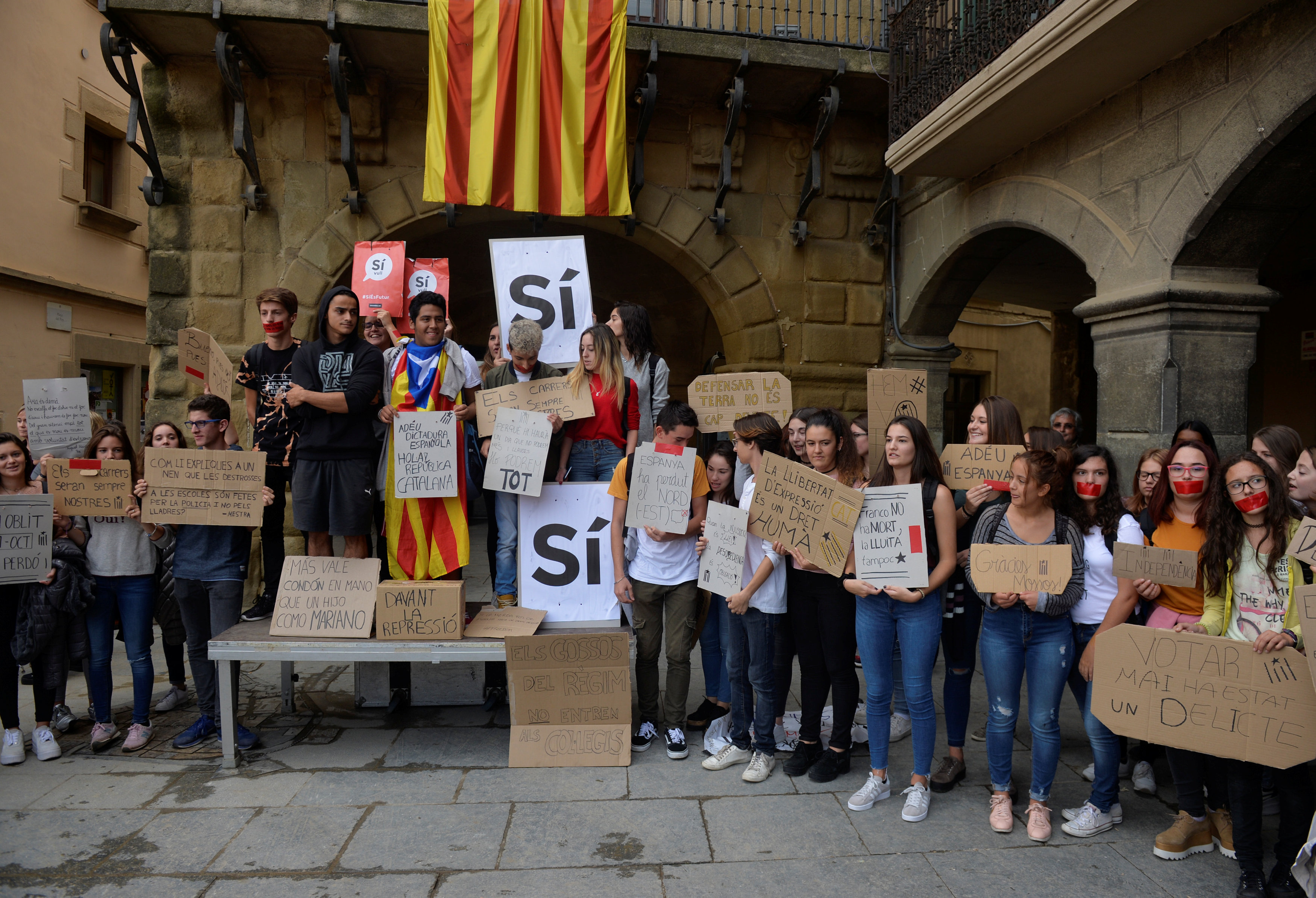 Students attend a protest called by pro-independence groups for citizens to gather at noon in front of city halls throughout Catalonia, in the Plaza Mayor of Vic