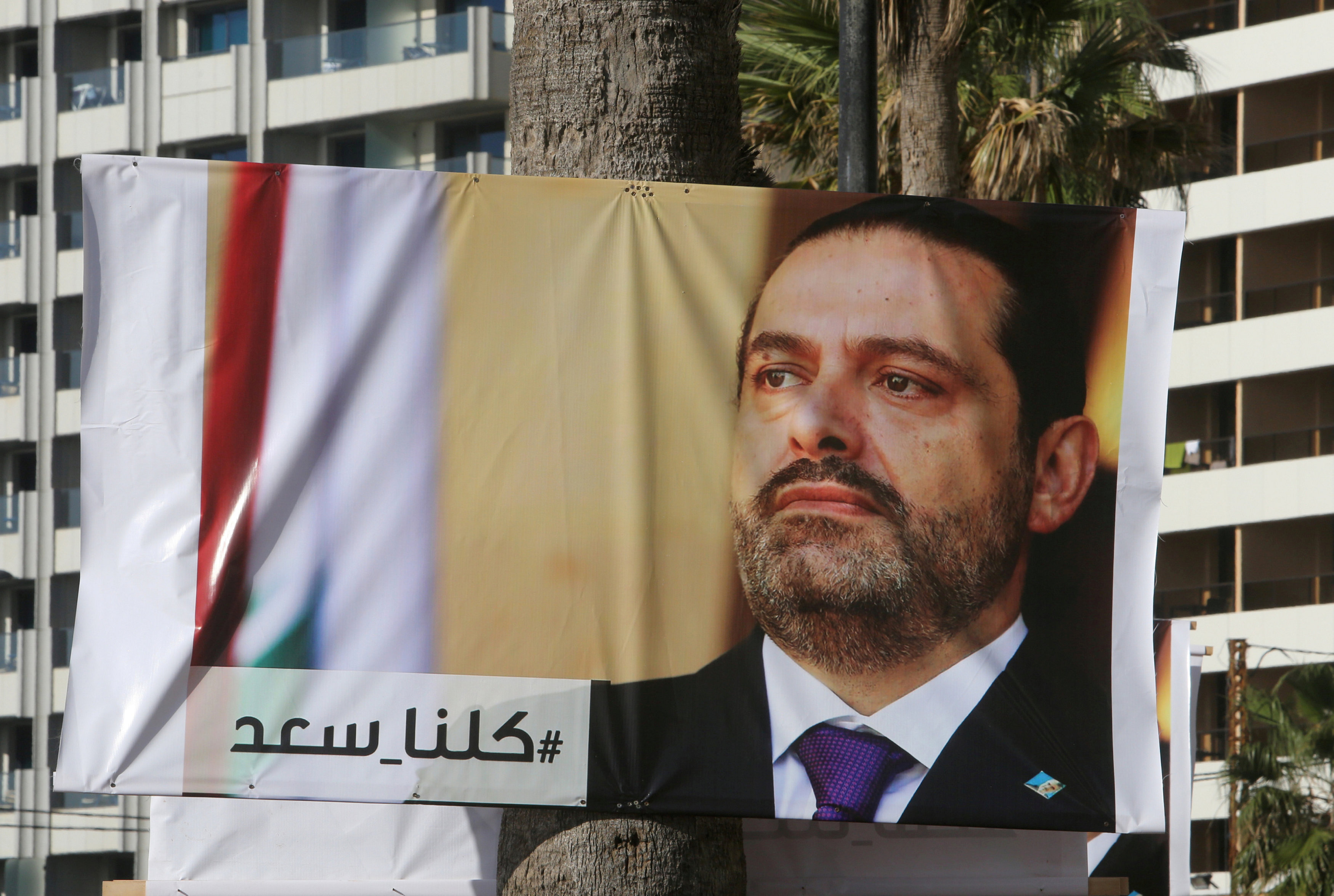 A poster depicting Lebanon's Prime Minister Saad al-Hariri, who has resigned from his post, is seen in Beirut
