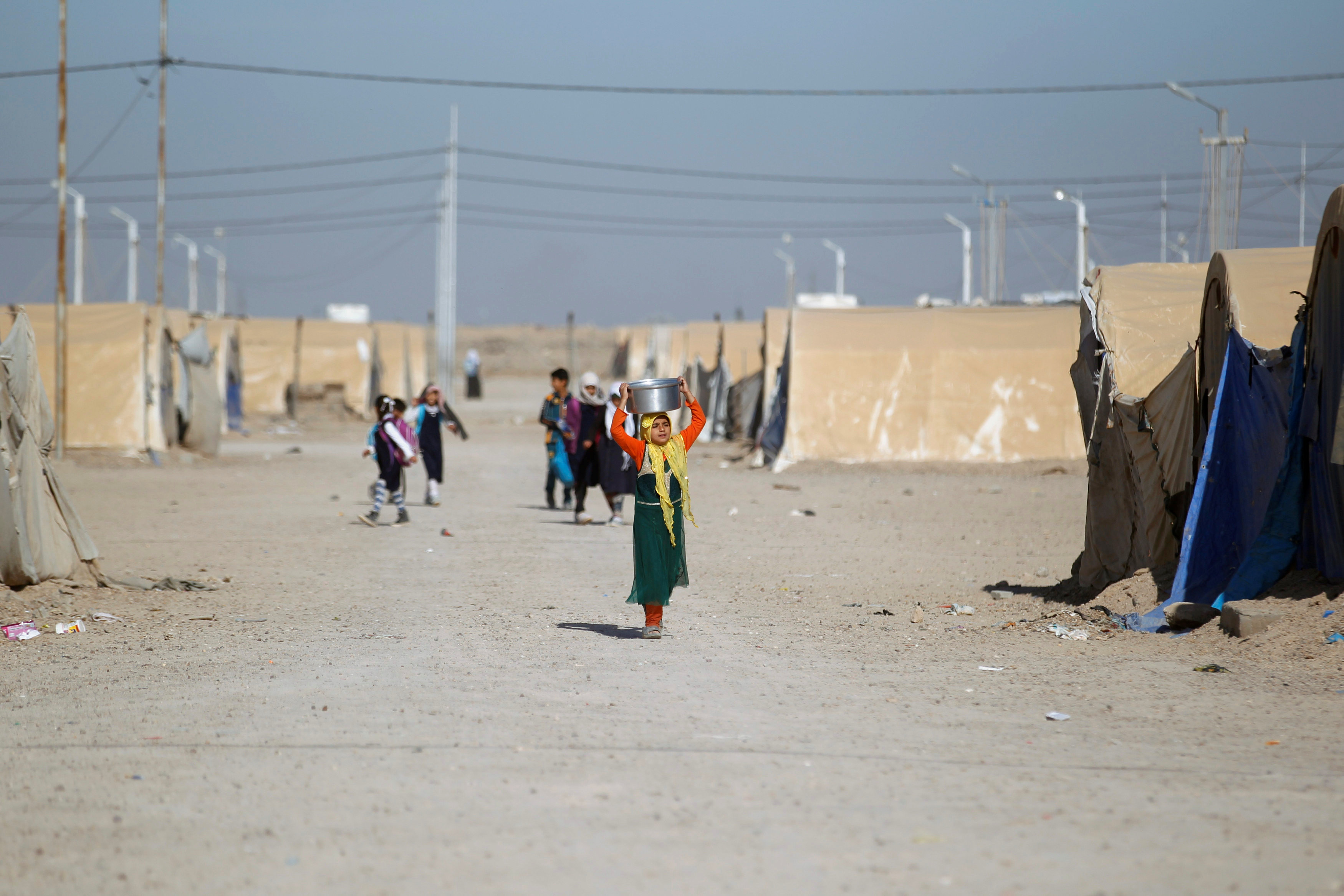 Displaced Iraqi people are seen at Amriyat al Fallujah camp in Anbar Province