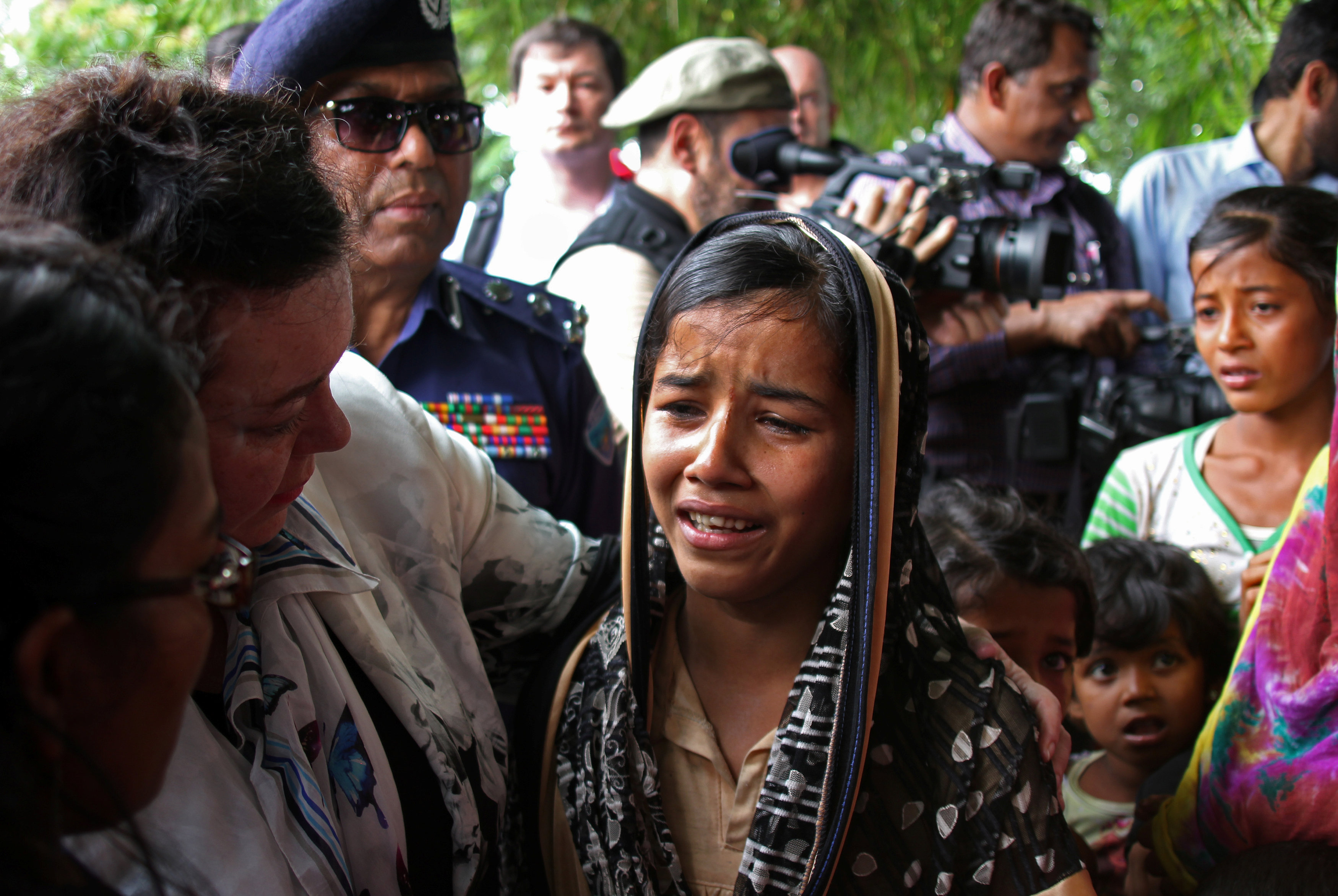 British United Nations Ambassador Karen Pierce consoles a twelve-year-old Rohingya refugee near Cox?s Bazar, in Bangladesh