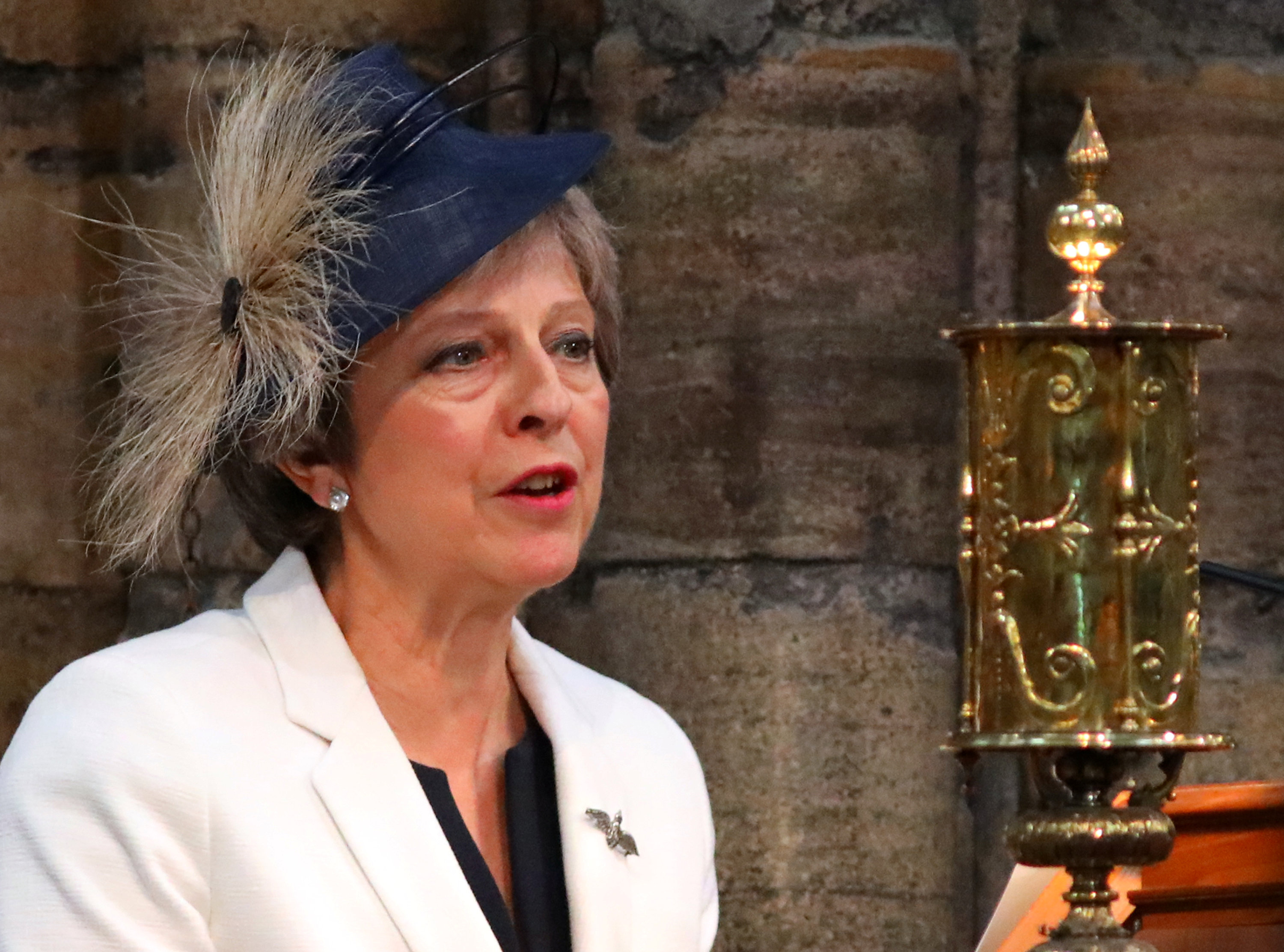 Britain's Prime Minister, Theresa May, speaks at Westminster Abbey for a service to mark the centenary of the Royal Air Force, in central London