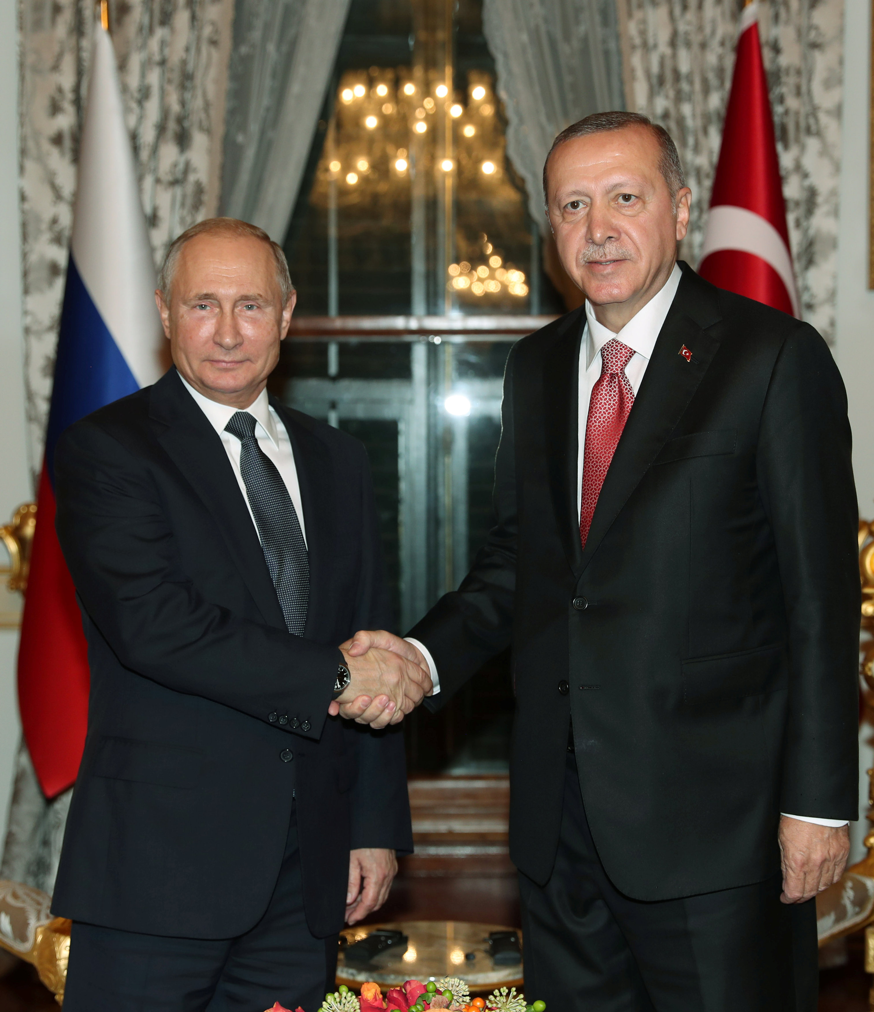 Turkish President Tayyip Erdogan and his Russian counterpart Vladimir Putin pose before a meeting in Istanbul