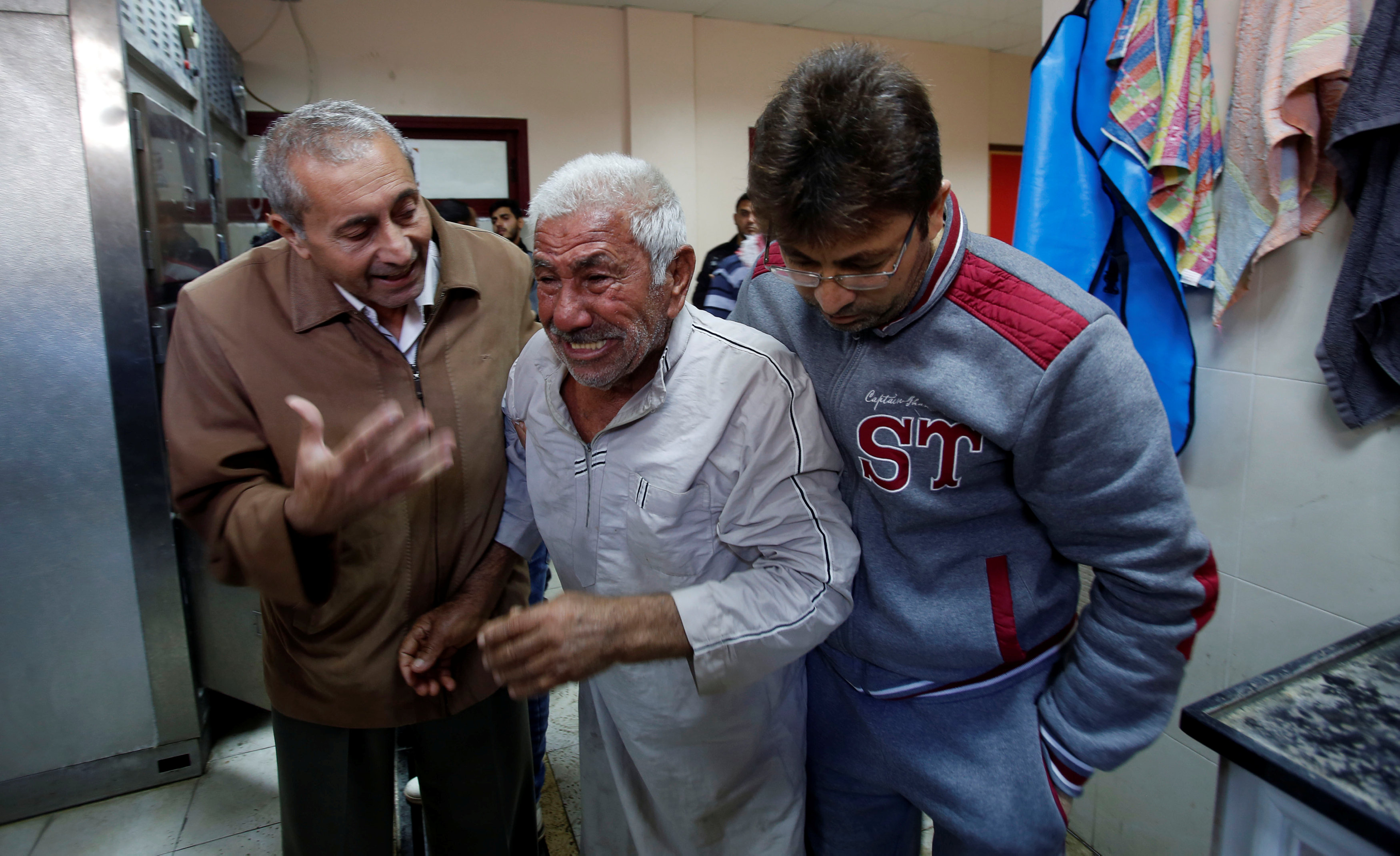 Father of Palestinian Khaled Sultan, who was killed in an Israeli air strike, mourns at a hospital in the northern Gaza Strip