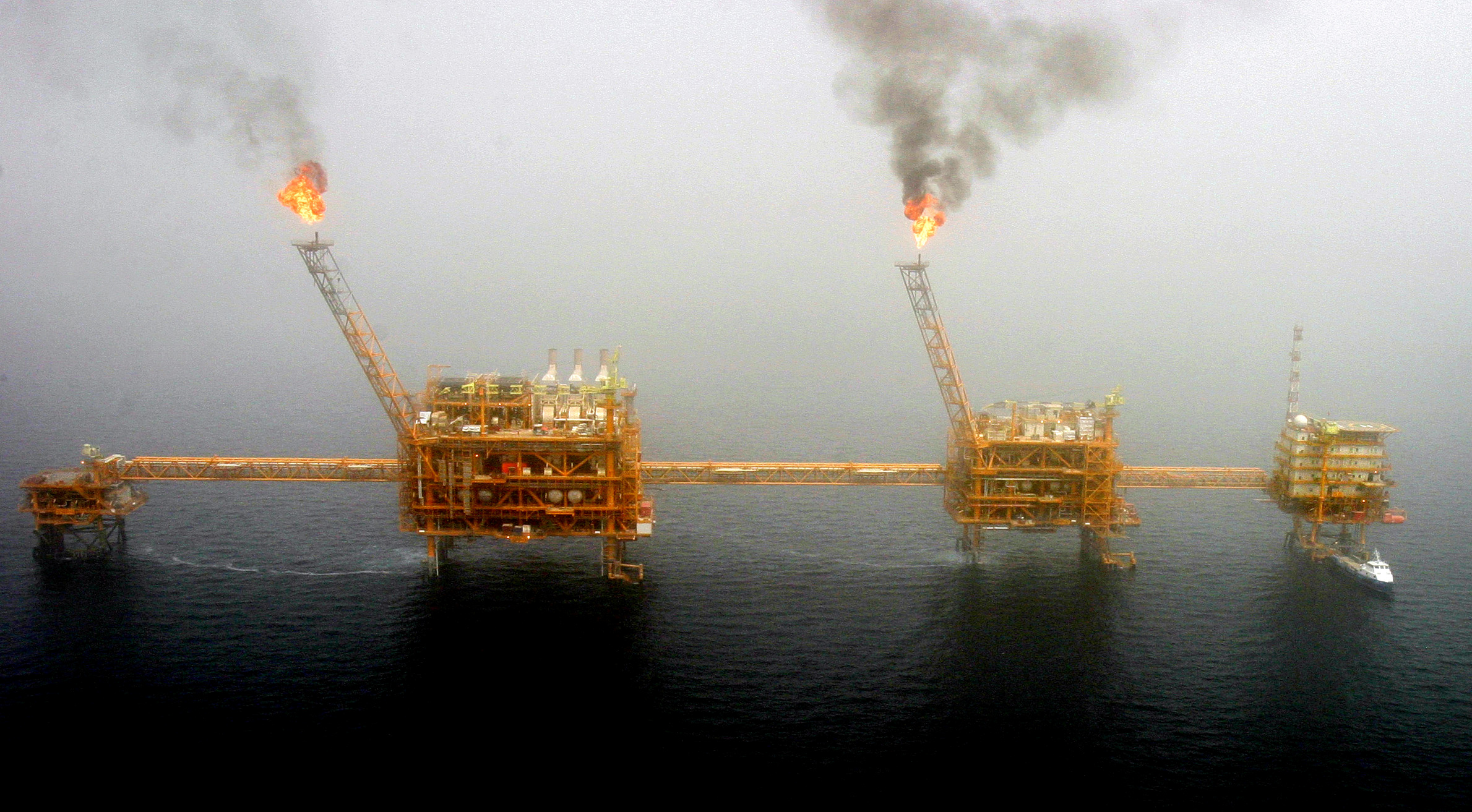 FILE PHOTO: Gas flares from an oil production platform are seen at the Soroush oil fields.