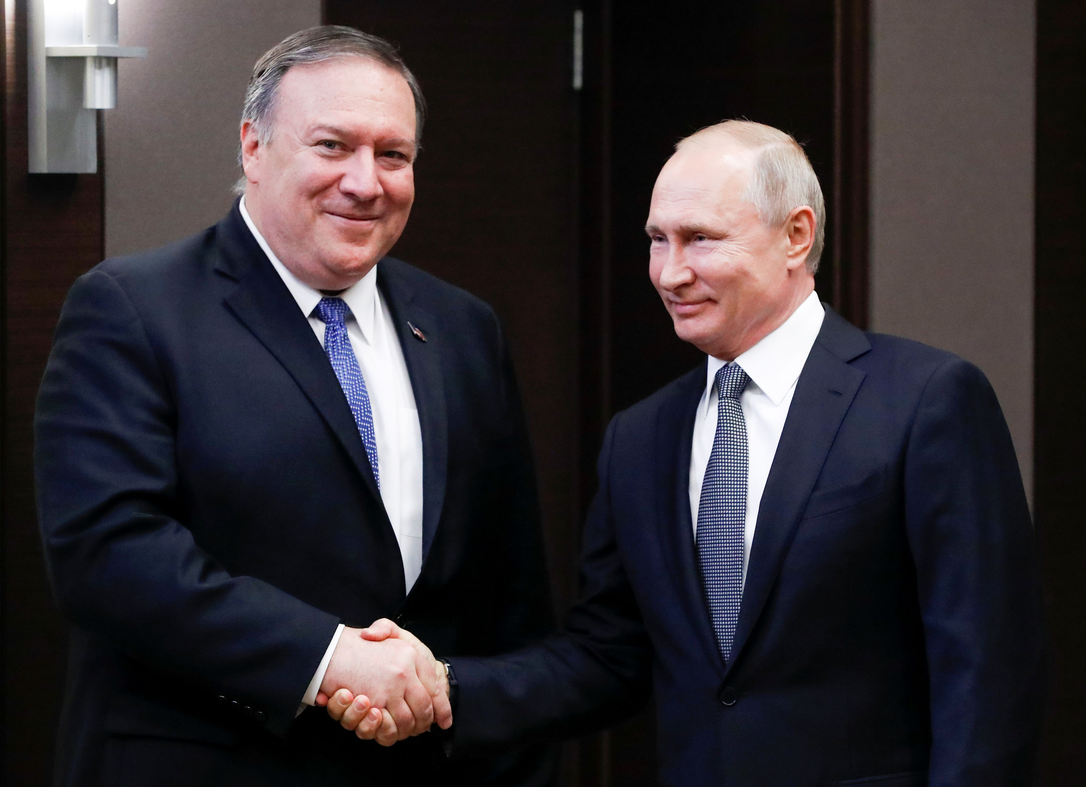 Russian President Vladimir Putin and U.S. Secretary of State Mike Pompeo pose for a photo prior to their talks in the Black Sea resort city of Sochi