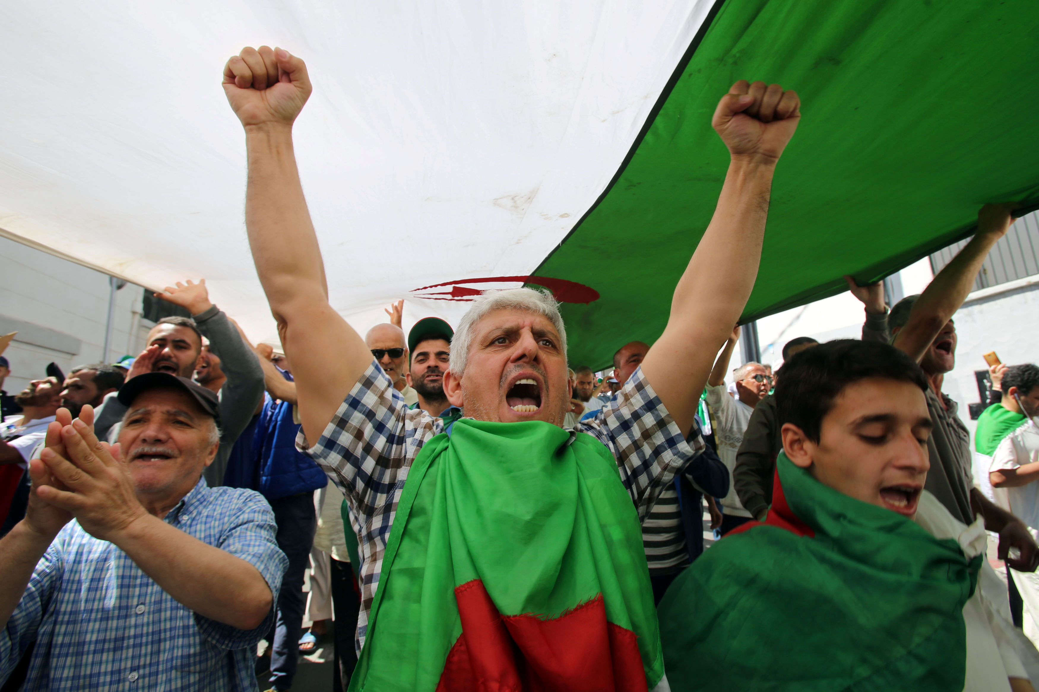 Man gestures during an anti-government protest in Algiers