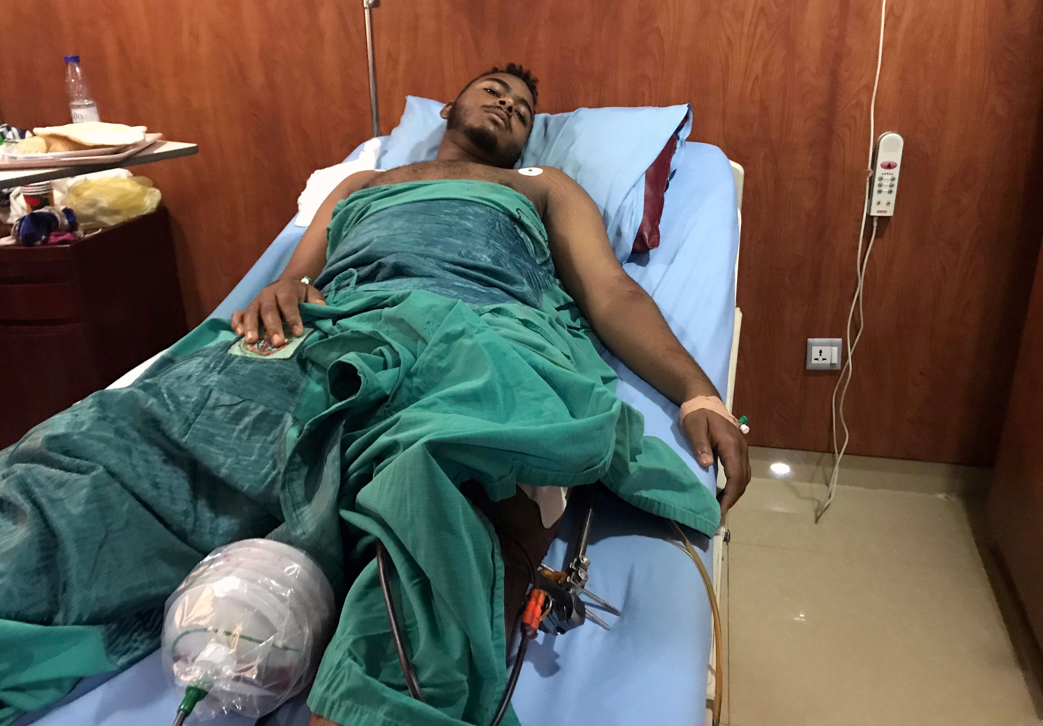 A victim of a gunshot wound sustained in the crackdown on Sudanese protesters is seen inside a ward receiving treatment in a hospital in Khartoum