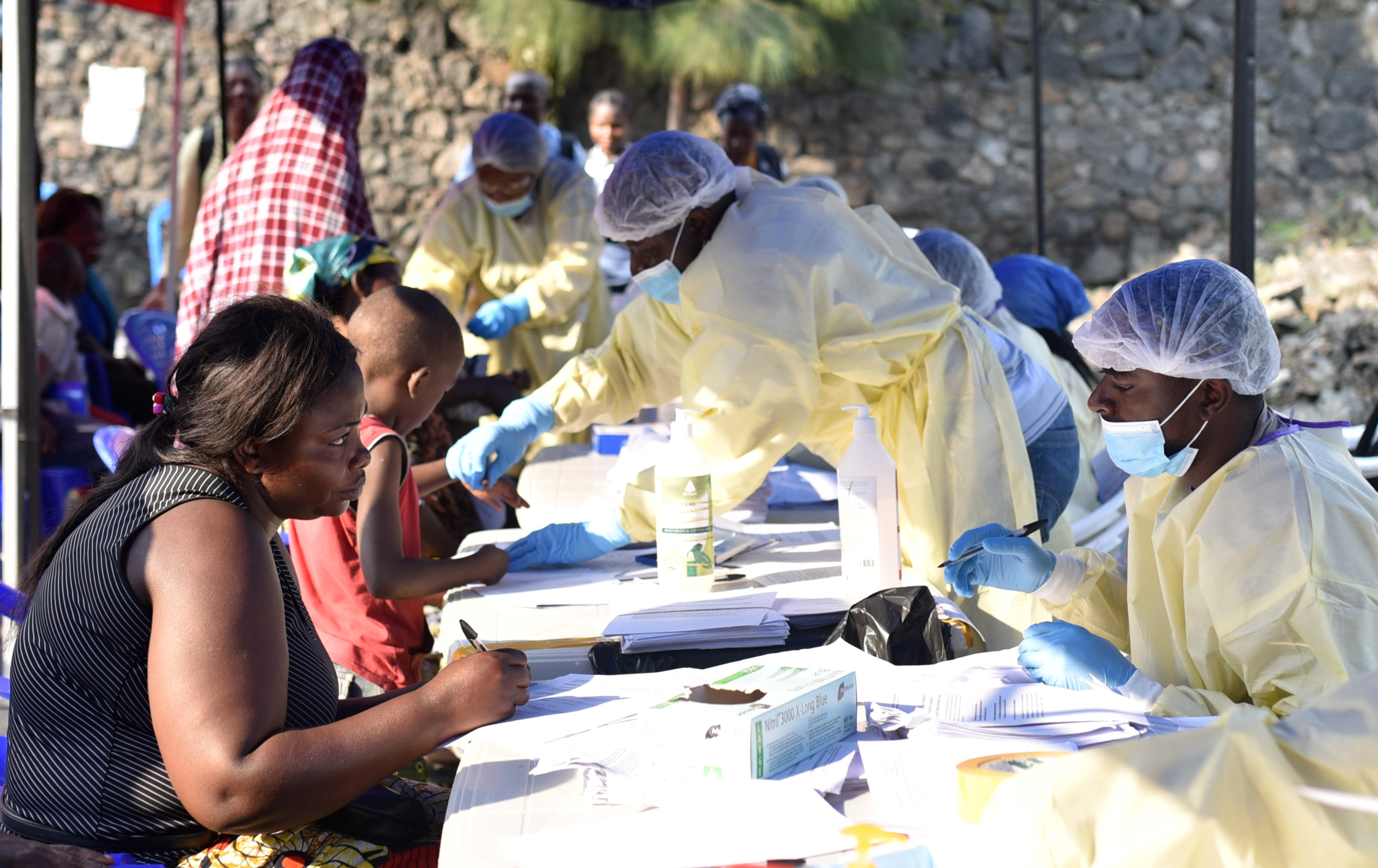 Congolese health workers collect data before administering ebola vaccines to civilians at the Himbi Health Centre in Goma