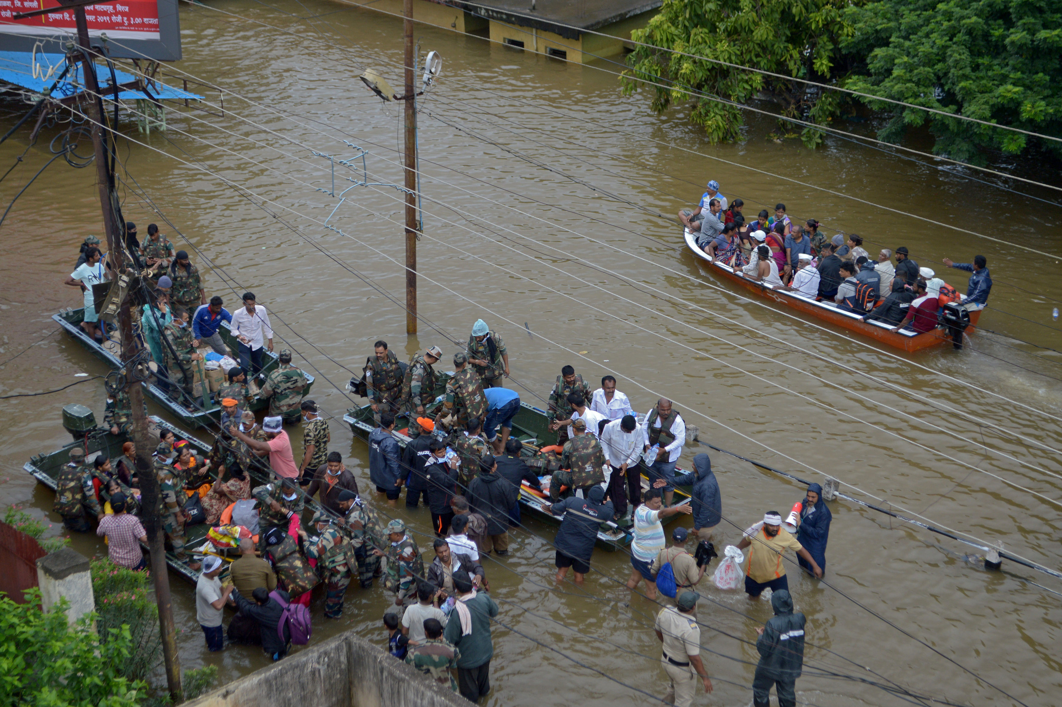 Army and Navy personnel evacuate flood-affected people to safer places in Sangli district