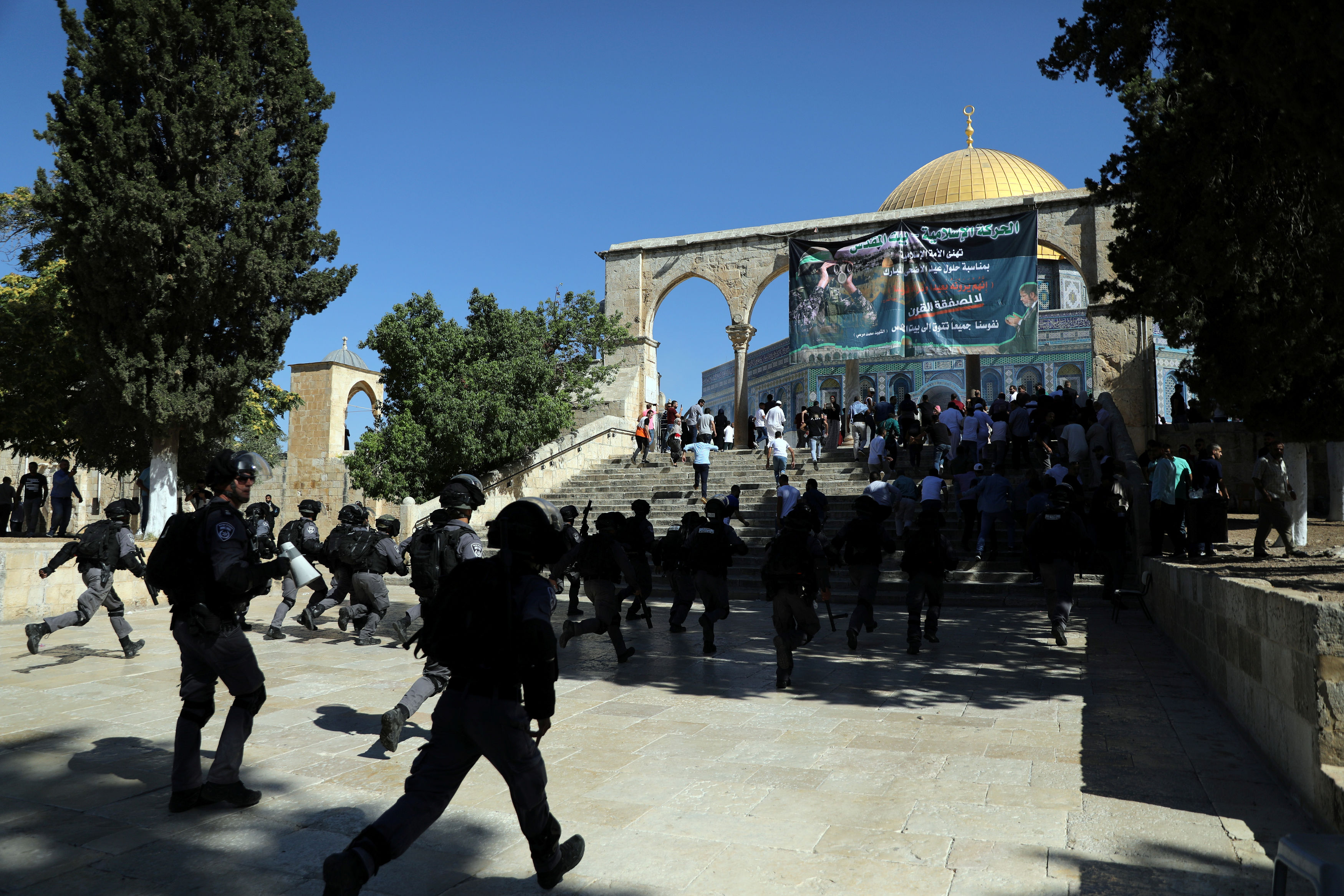The Dome of the Rock is seen in the background during clashes between Israeli police and Palestinian worshippers on the compound known to Muslims as Noble Sanctuary and to Jews as Temple Mount as Muslims mark Eid al-Adha in Jerusalem's Old City