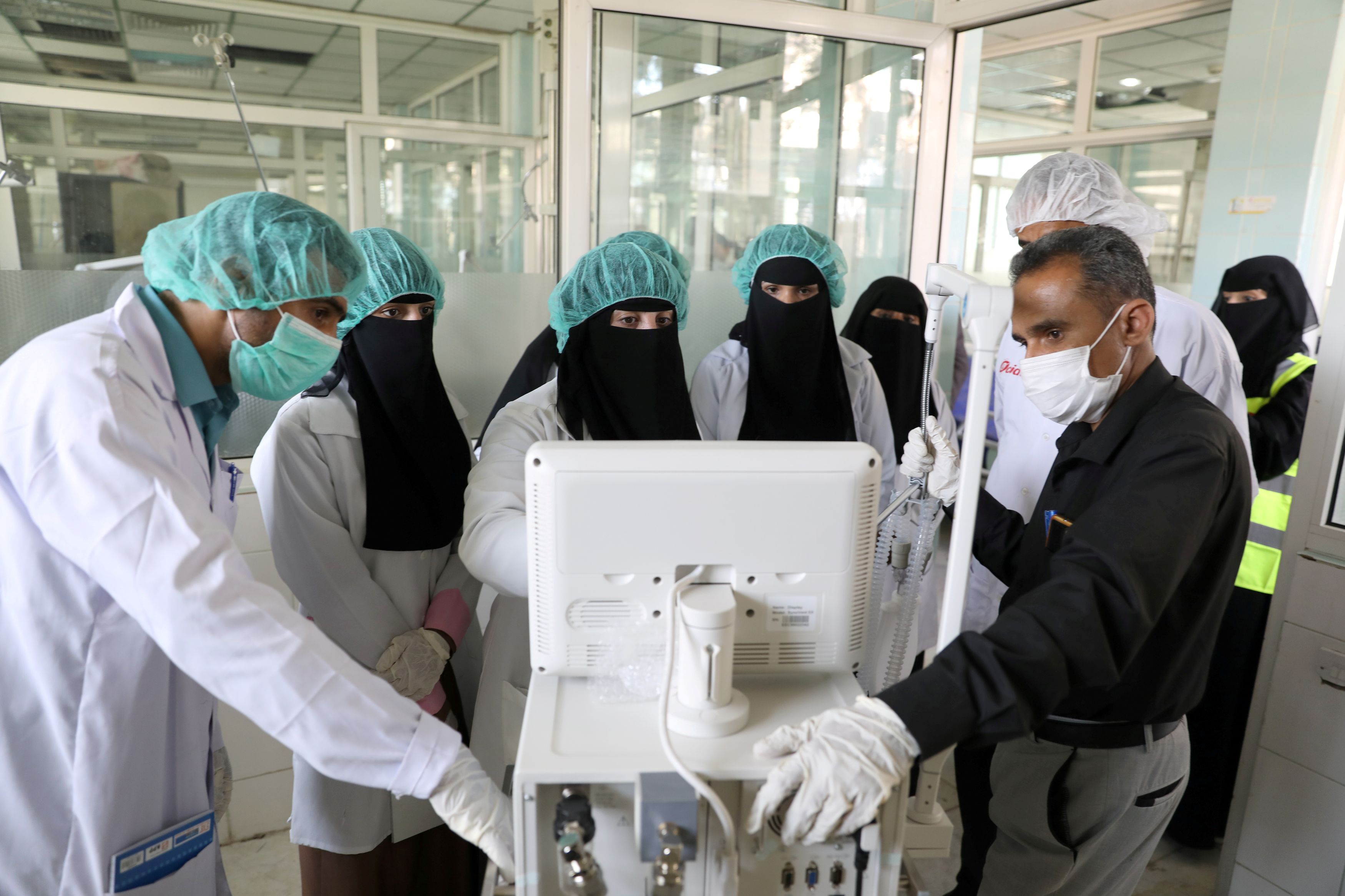 FILE PHOTO: Nurses receive training on using ventilators, recently provided by the World Health Organization, in a hospital wing allocated for coronavirus patients in Sanaa, Yemen
