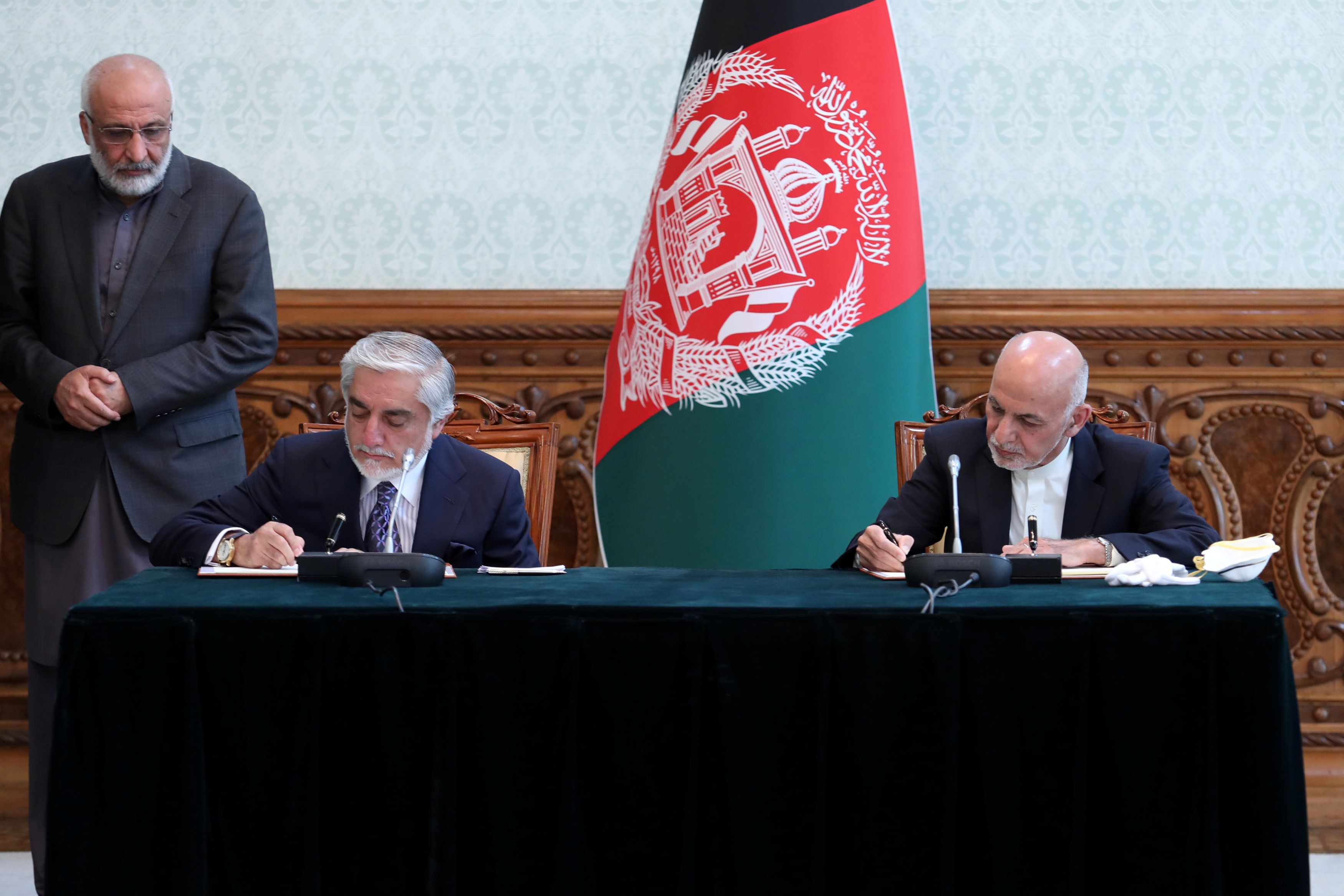 Afghanistan's President Ashraf Ghani and his rival Abdullah Abdullah sign agreement in Kabul