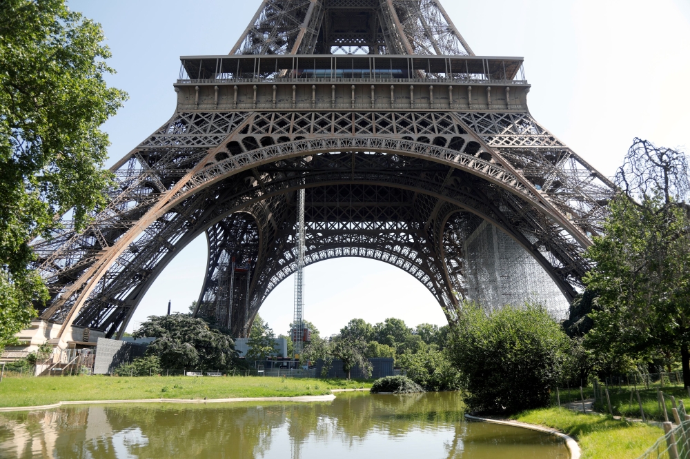 Paris' Eiffel tower re-opens to the public