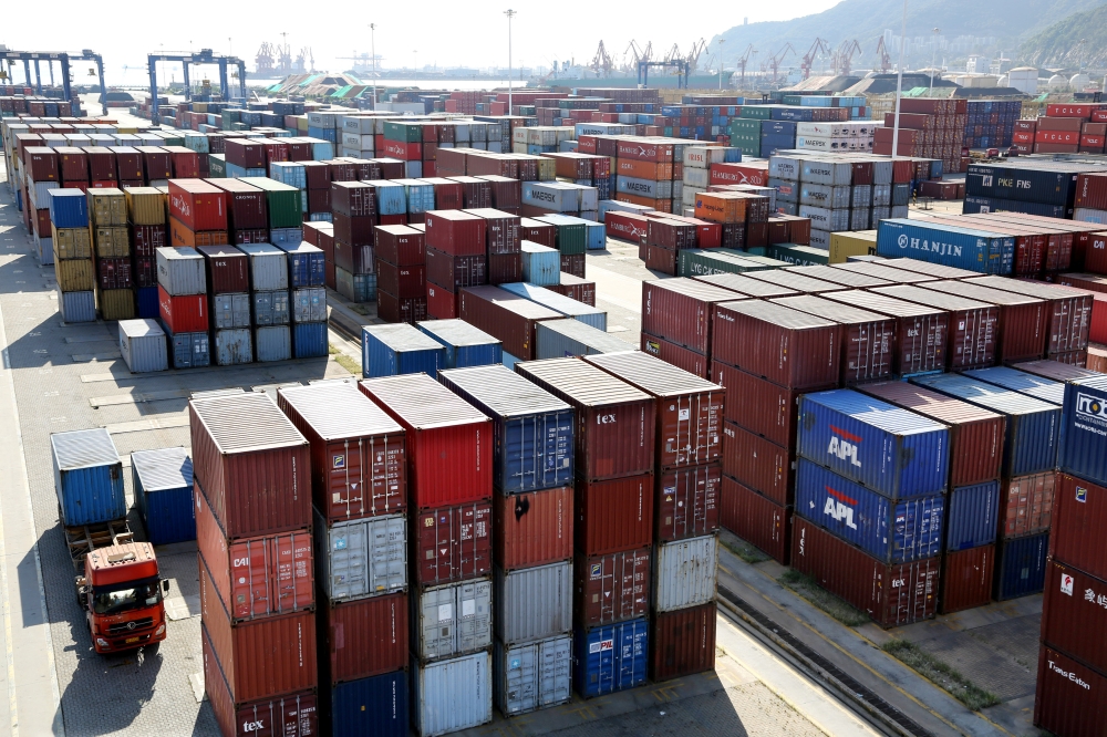 Shipping containers are seen at a port in Lianyungang