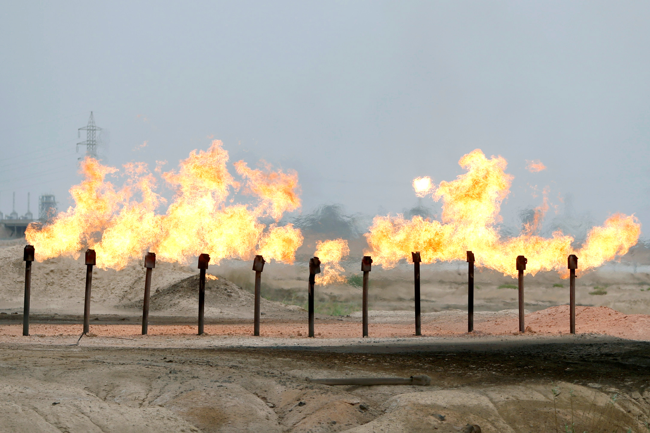 FILE PHOTO: Flames are seen at a station in al-Zubair oilfield, near Basra