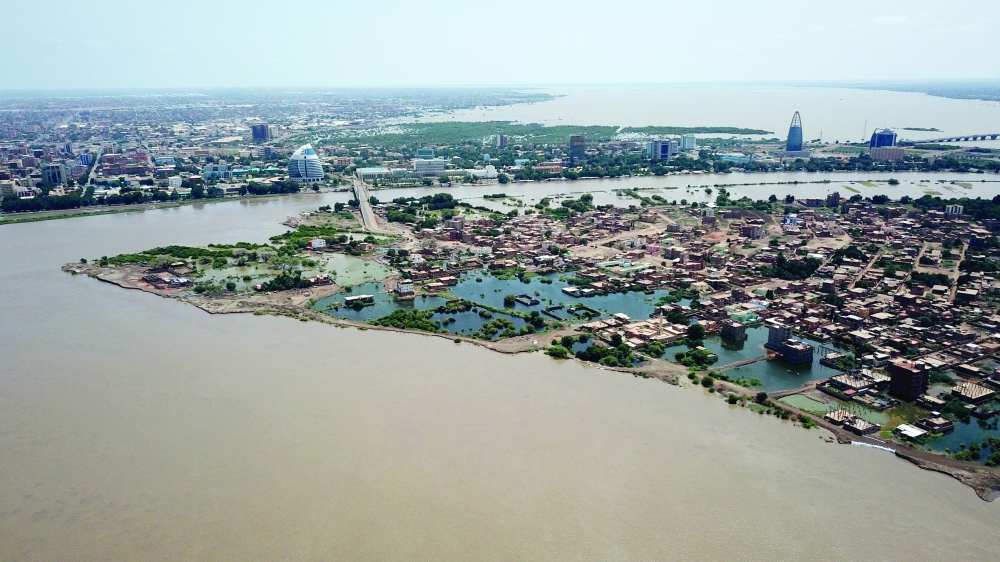 An aerial view shows buildings and roads submerged by floodwaters near the Nile River in South Khartoum