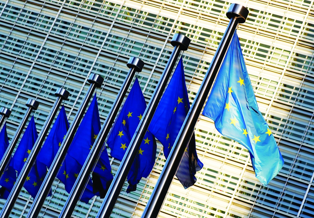 FILE PHOTO: EU flags outside the EU Commission headquarters in Brussels