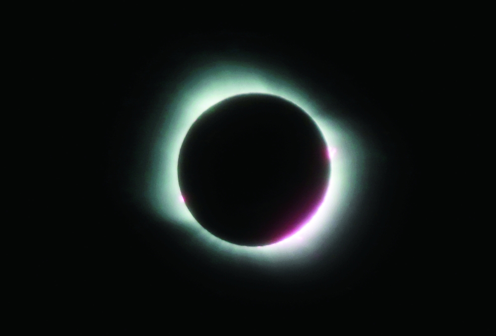 A total solar eclipse, visible in parts of Chile and Argentina, is seen in Las Grutas, in the Rio Negro province